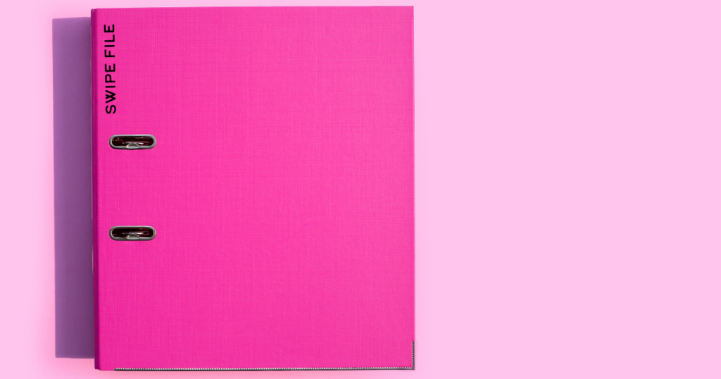 Bright pink folder against light pink background