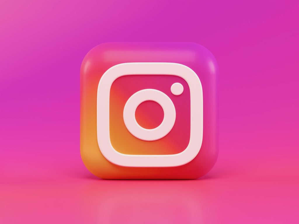 Instagram logo on bright pink background