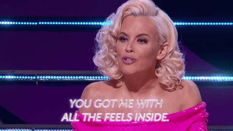 Animated GIF of woman in pink dress saying "You got me with all the feels inside." 