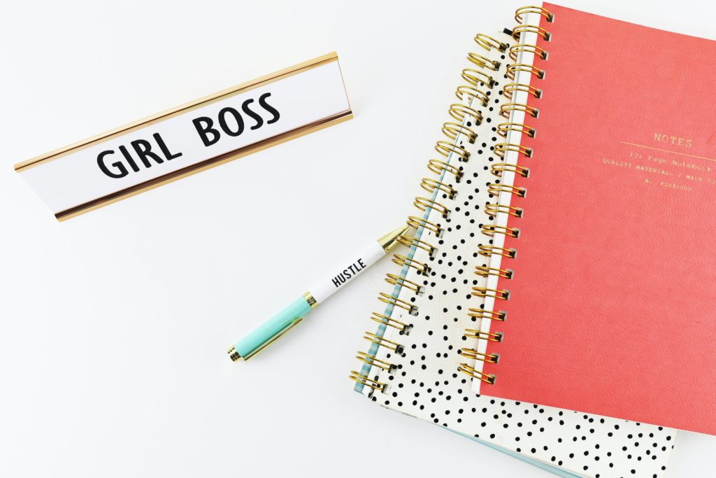 Girl Boss desk tag with notebooks and pen saying hustle