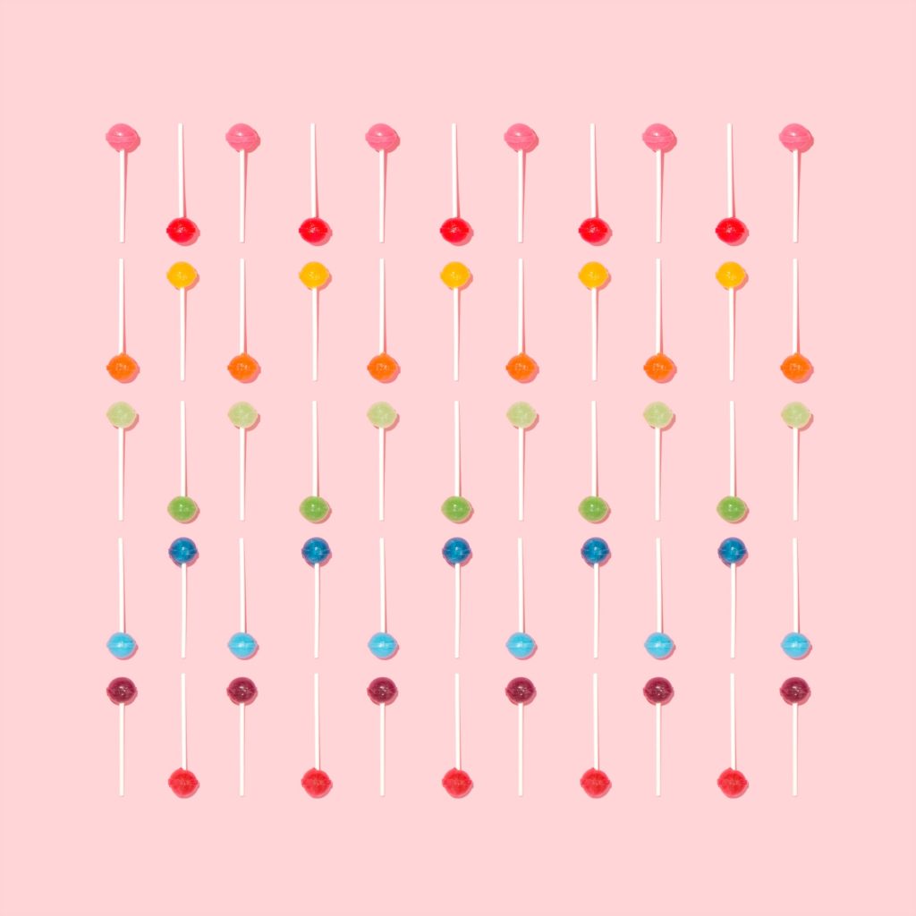Collection of lollipops against pink background